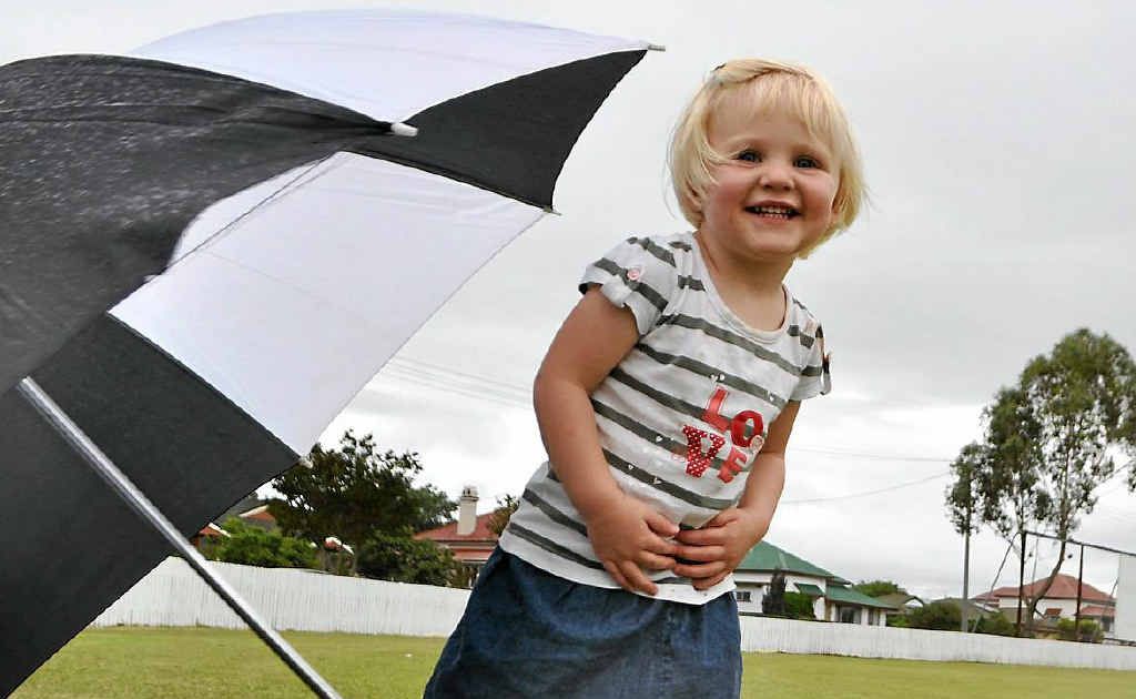 Ashleigh Hay, 22 months, is undeterred by the menacing clouds building behind her. Ashleigh Hay, 22 months, is undeterred by the menacing clouds building behind her.